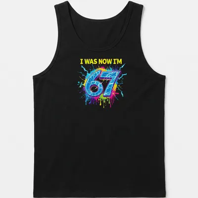 Colorful splatter design t-shirt with the text I WAS NOW I'M 67