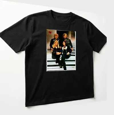 Retro ABBA t-shirt with bold lettering and classic colors — printed on a unisex t-shirt (angled view)