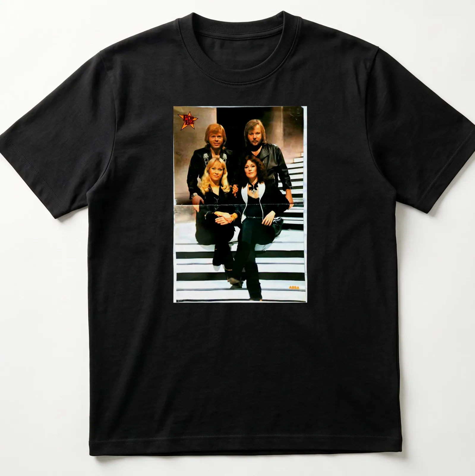Retro ABBA t-shirt with bold lettering and classic colors — printed on a unisex t-shirt