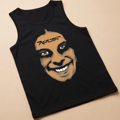 Minimalist t-shirt featuring a smiling face and 'Aphex Twin' text in orange and white. — printed on a tank top