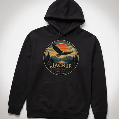 Vintage-style shirt featuring a bald eagle and memorial text in blue, orange, green, and brown. — printed on a unisex hoodie