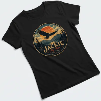 Vintage-style shirt featuring a bald eagle and memorial text in blue, orange, green, and brown. — printed on a women's shirt