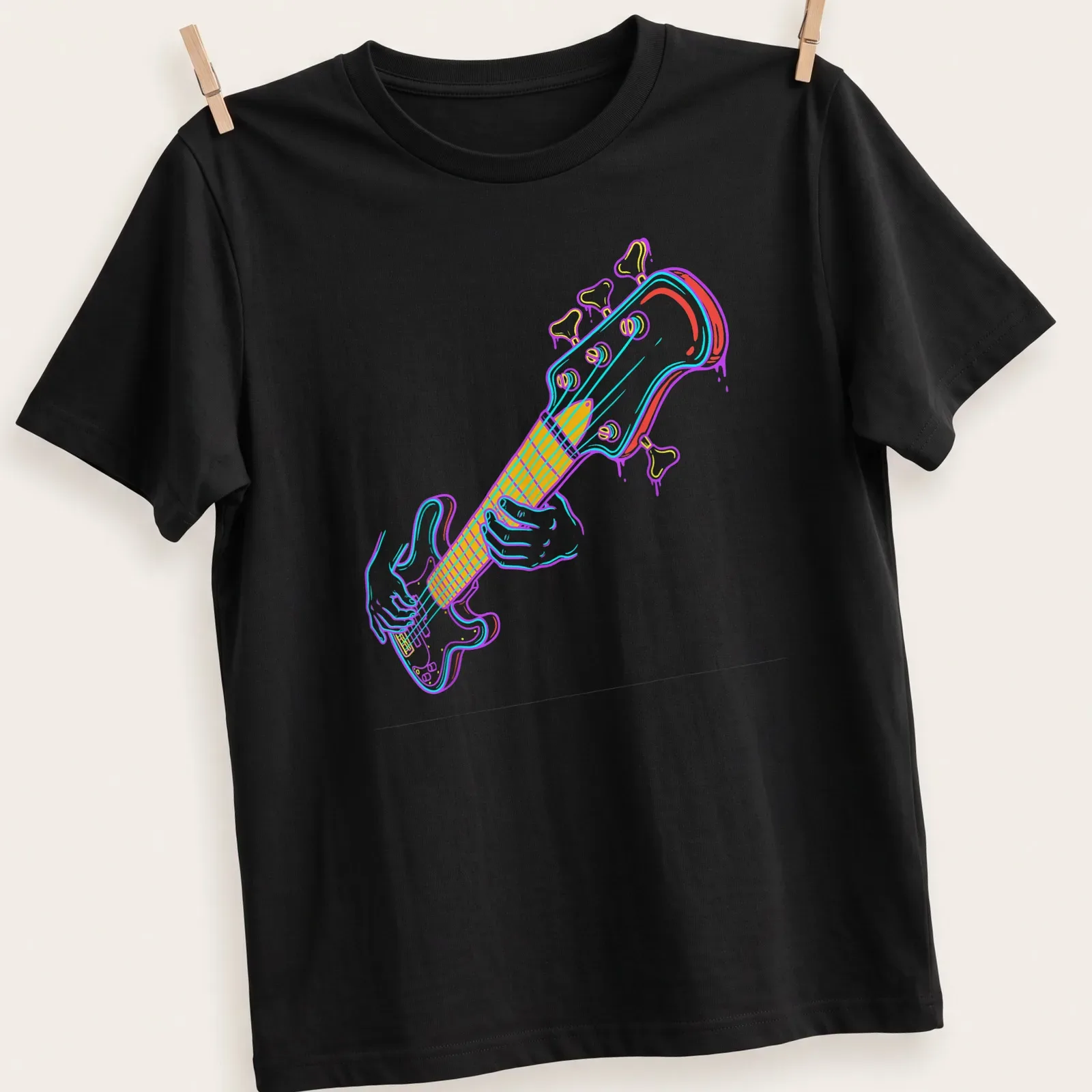 Colorful line-art of a bass guitar player in pink, blue, yellow, and white — printed on a unisex t-shirt
