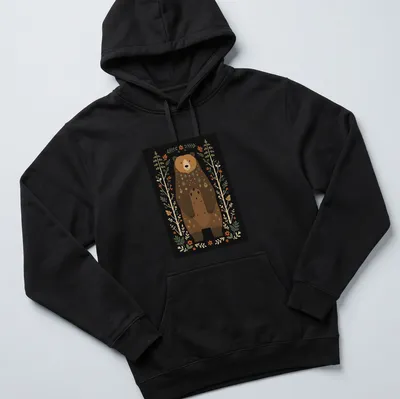 Illustration of a bear in Scandinavian folk art style with vibrant colors — printed on a unisex hoodie