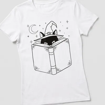 Line art of a black cat reading a book while wearing a witch hat — printed on a women's shirt