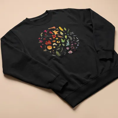 Botanical circle wreath design with colorful wildflowers and the word 'origins' — printed on a unisex sweatshirt