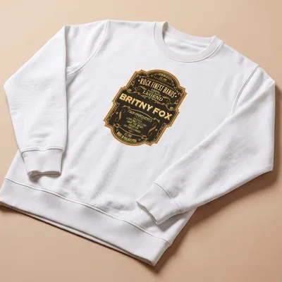 Vintage badge shirt featuring Britny Fox and their song titles in black, gold, and cream. — printed on a unisex sweatshirt