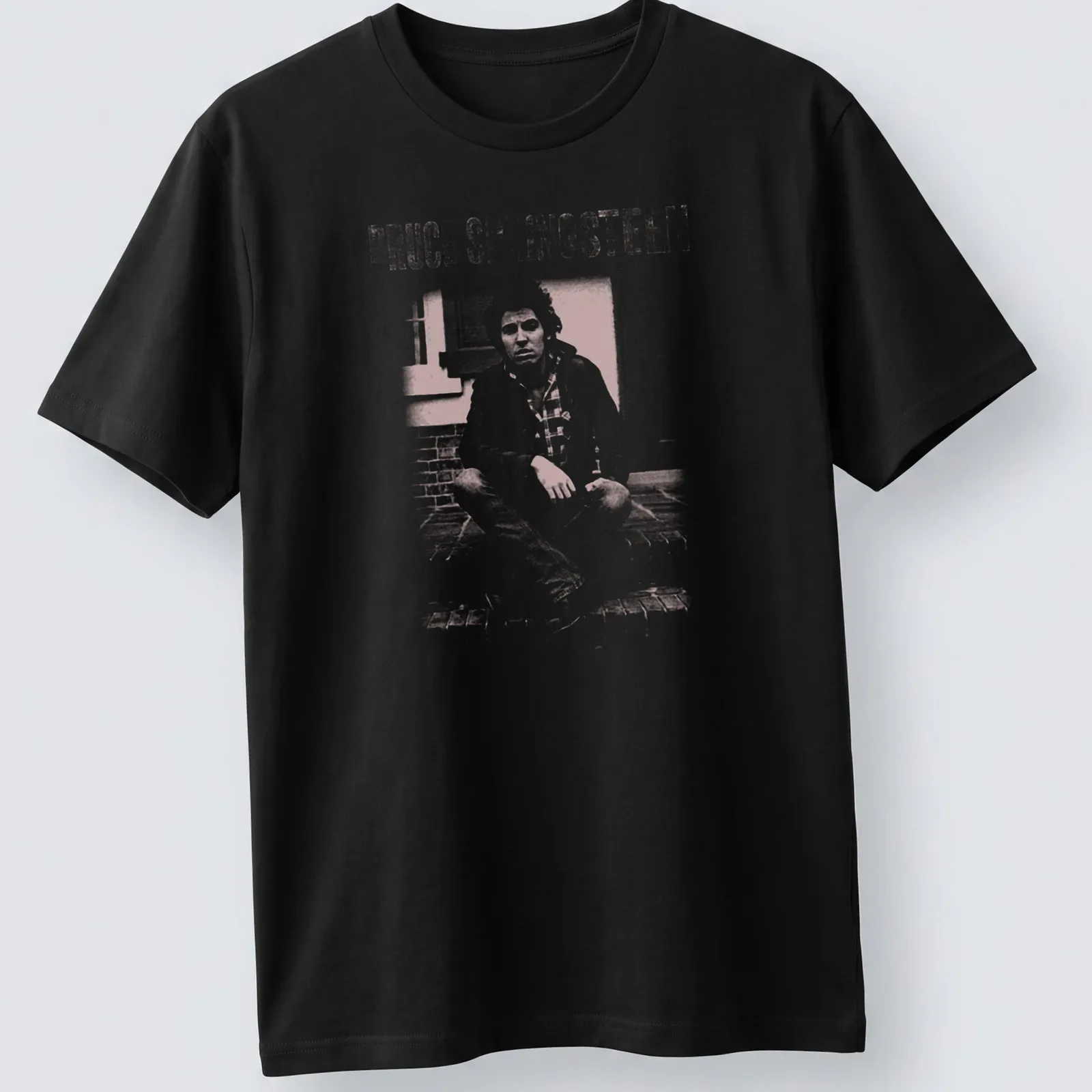 Fanart style t-shirt featuring Bruce Springsteen's name in white and light pink — printed on a unisex t-shirt