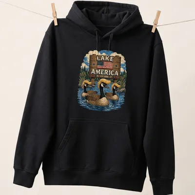 Vintage style t-shirt featuring Canadian geese with retro hairstyles and lake theme — printed on a unisex hoodie