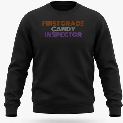 Bold striped Halloween tee featuring First Grade Candy Inspector text — printed on a unisex sweatshirt