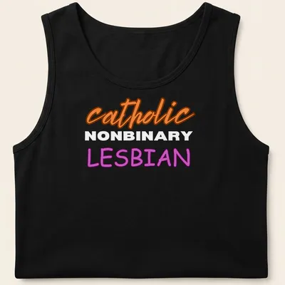 Bold typography design featuring 'catholic NONBINARY LESBIAN' in orange, white, and purple — printed on a tank top