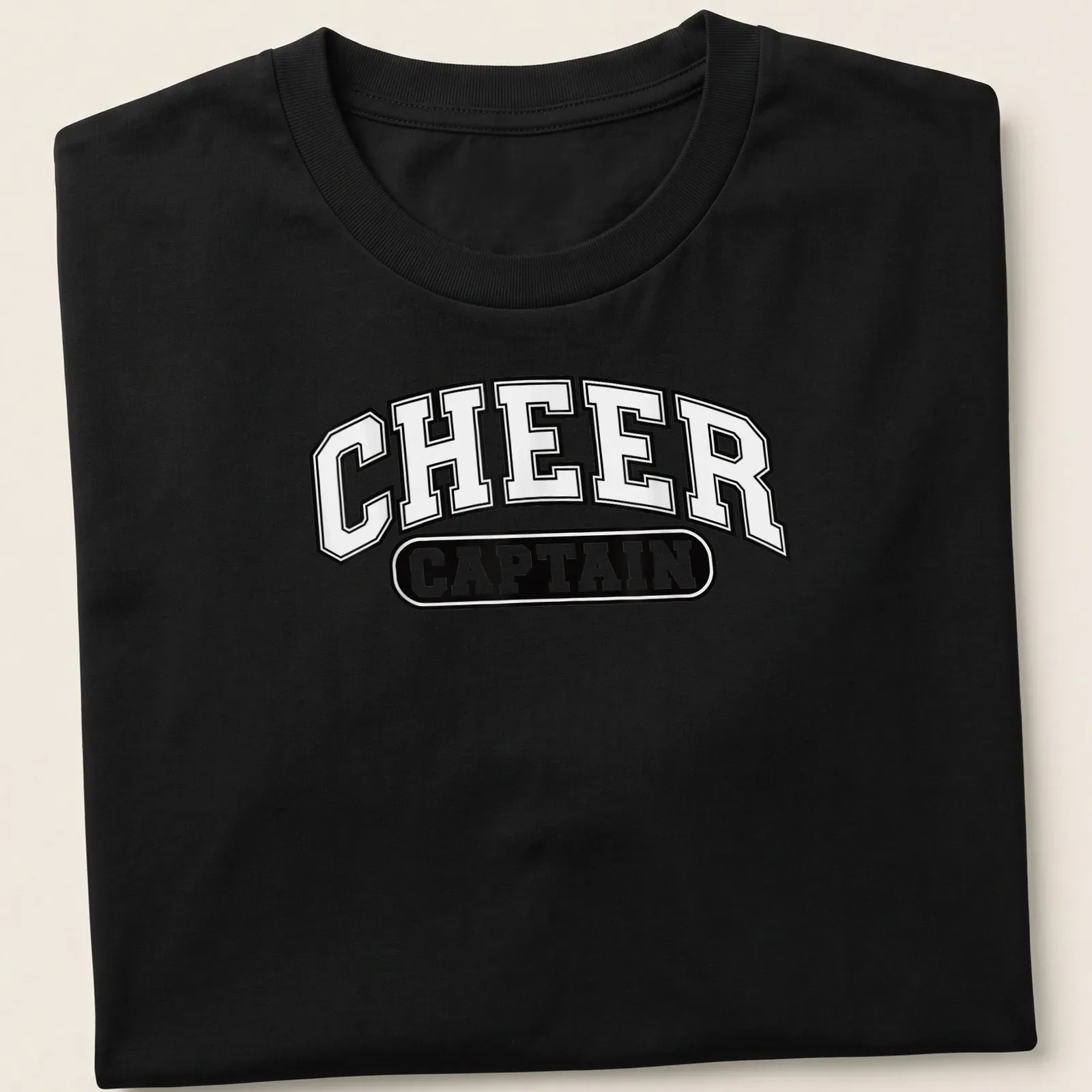 Bold collegiate 'Cheer Captain' t-shirt in black and white — printed on a unisex t-shirt