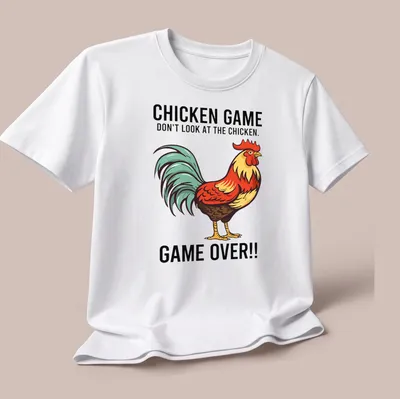 Vintage cartoon style Chicken Game t-shirt with colorful rooster and humorous text — printed on a unisex t-shirt (angled view)