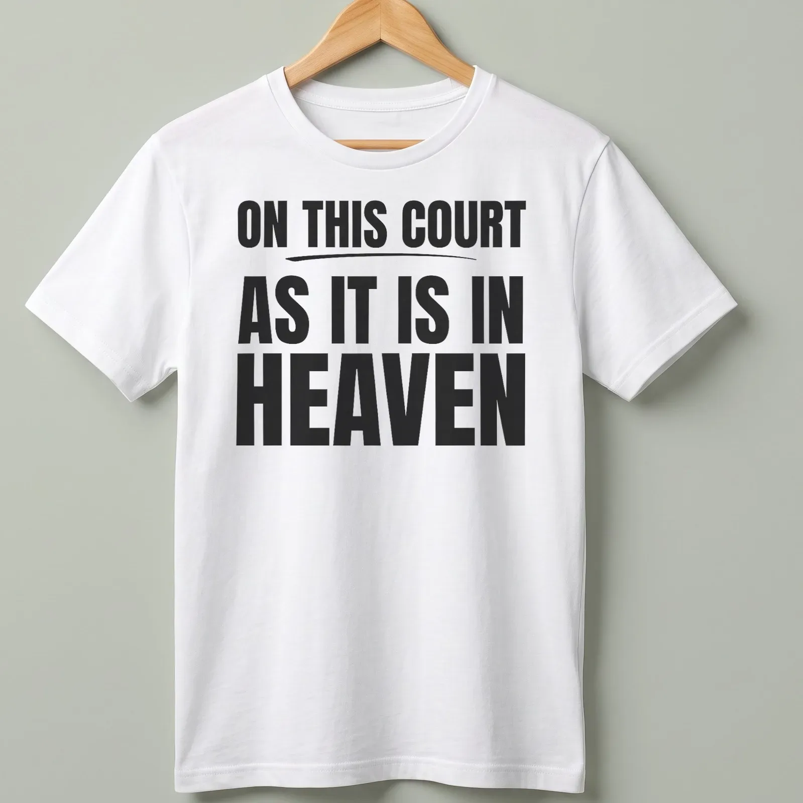 T-shirt with bold typography proclaiming 'ON THIS COURT AS IT IS IN HEAVEN' in black and white. — printed on a unisex t-shirt