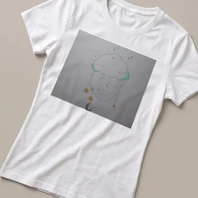 Whimsical illustration of a cloud dream catcher with stars in light blue and yellow — printed on a women's shirt
