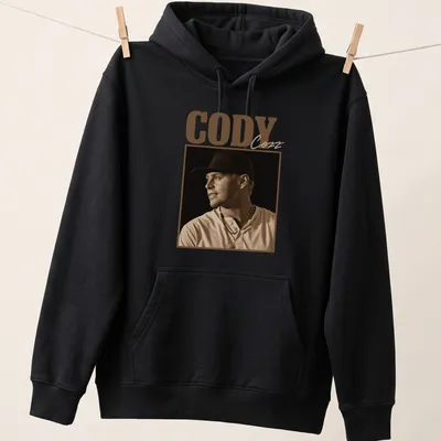 Vintage sepia t-shirt with the text Cody Cozz in brown and cream — printed on a unisex hoodie
