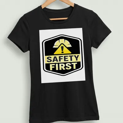Bold graphic shirt featuring a safety helmet and the text Safety First — printed on a women's shirt