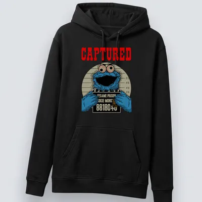 Cartoon mugshot of Cookie Monster with humorous text in blue, red, and black — printed on a unisex hoodie