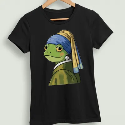 Cartoon frog inspired by Vermeer, styled with vibrant colors and a playful expression — printed on a women's shirt