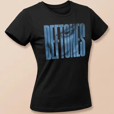 Halftone printed text 'DEFTONES' in blue on a retro style — printed on a women's shirt