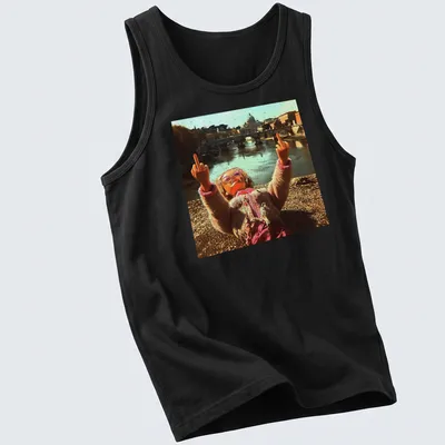 Distressed vintage t-shirt featuring a doll and meme text in pink, beige, and brown — printed on a tank top