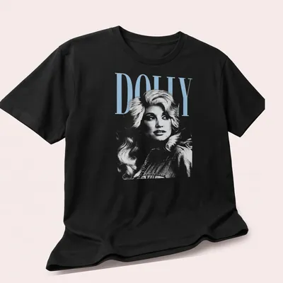 Vintage Dolly Parton t-shirt featuring the name Dolly in a classic font — printed on a unisex t-shirt (angled view)