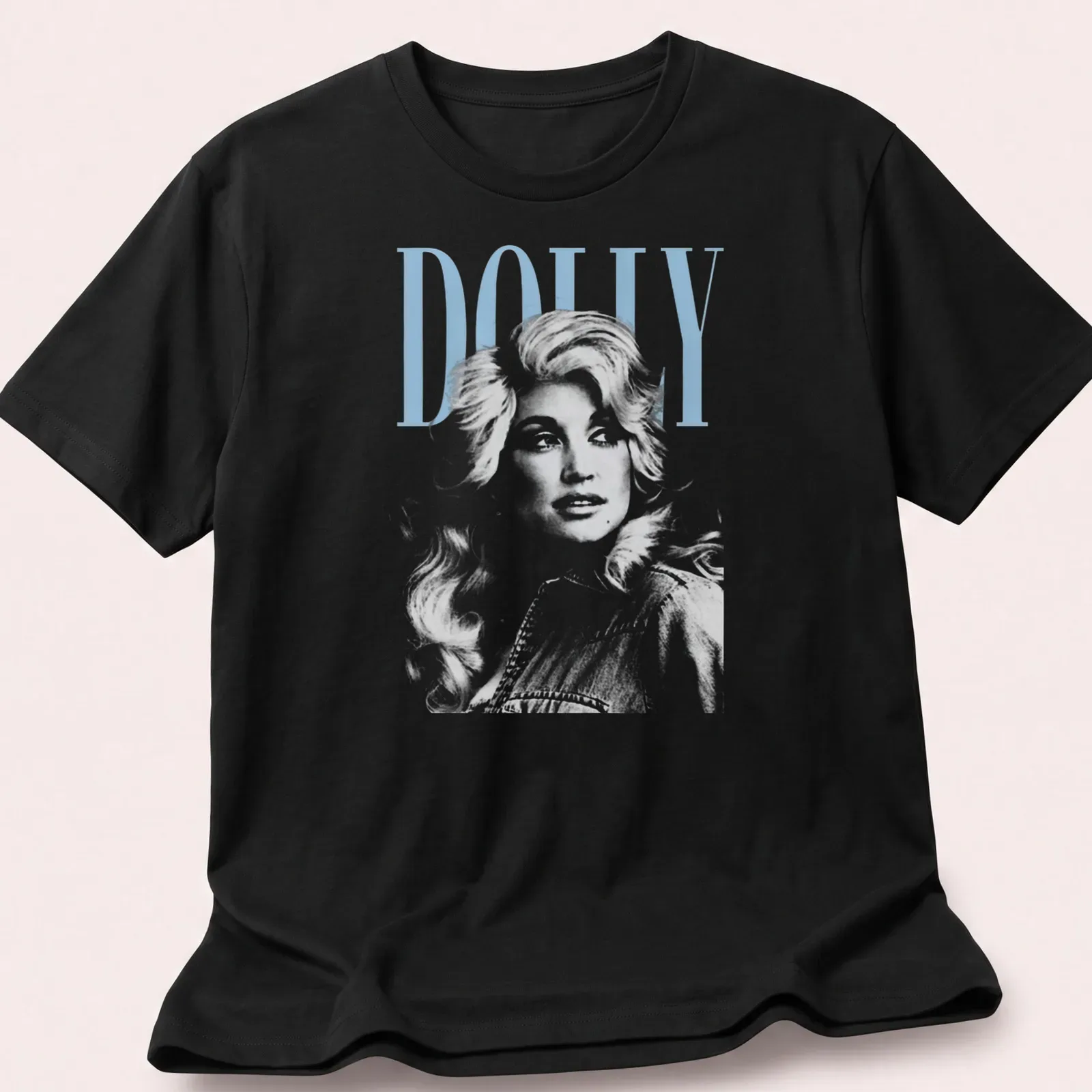 Vintage Dolly Parton t-shirt featuring the name Dolly in a classic font — printed on a unisex t-shirt