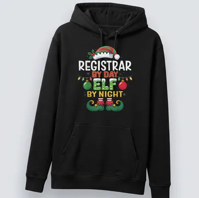 Colorful holiday-themed t-shirt featuring a Christmas elf and whimsical text — printed on a unisex hoodie