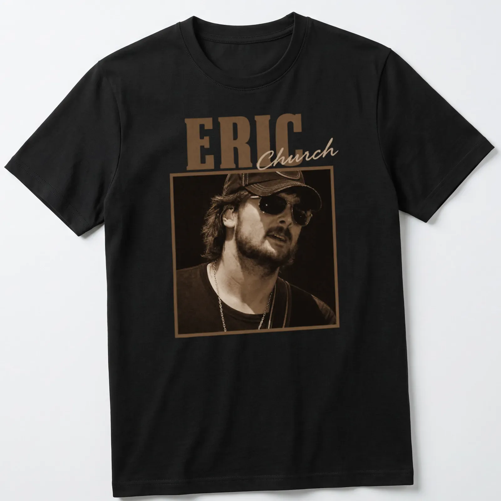 Sepia-tone Eric Church t-shirt with bold lettering in brown and cream — printed on a unisex t-shirt
