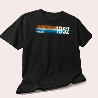Vintage retro t-shirt with Established 1952 text in orange, blue, and white — printed on a unisex t-shirt (angled view)