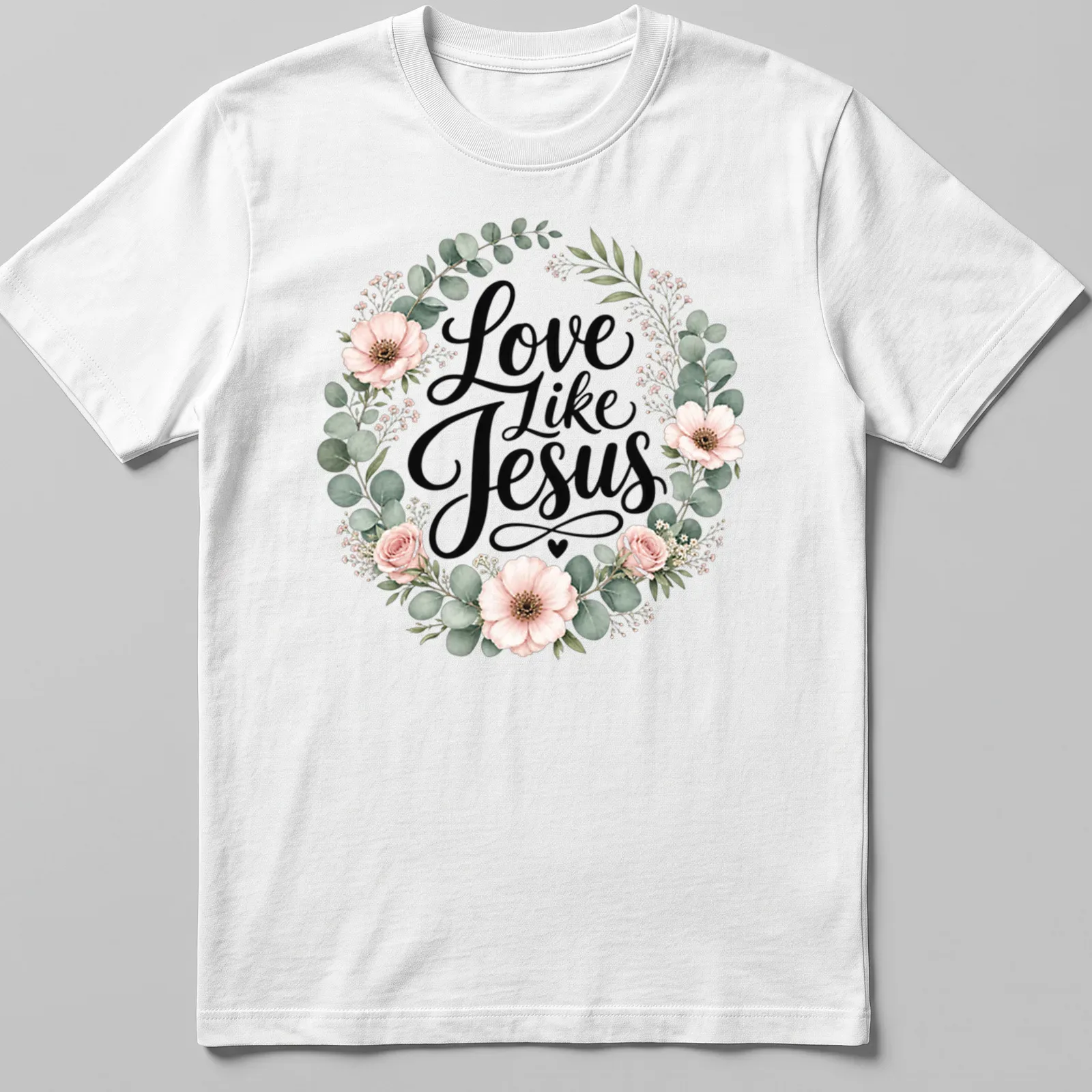 Floral wreath design with the text 'Love Like Jesus' in modern script — printed on a unisex t-shirt