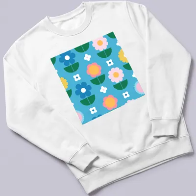 Colorful flower pattern in blue, pink, yellow, green, and white on a T-shirt. — printed on a unisex sweatshirt