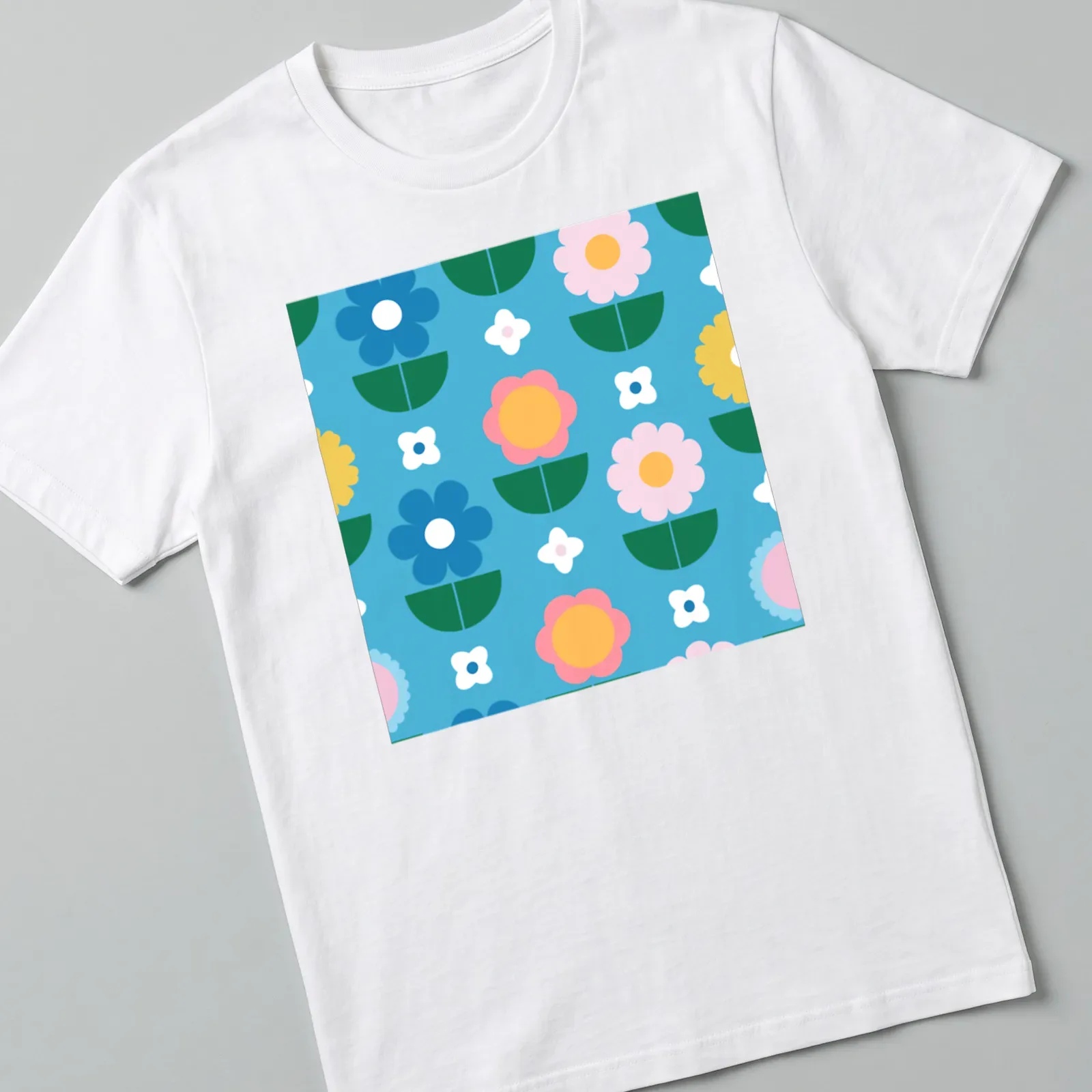 Colorful flower pattern in blue, pink, yellow, green, and white on a T-shirt. — printed on a unisex t-shirt
