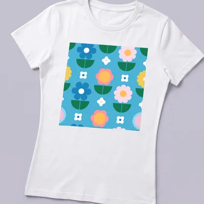 Colorful flower pattern in blue, pink, yellow, green, and white on a T-shirt. — printed on a women's shirt