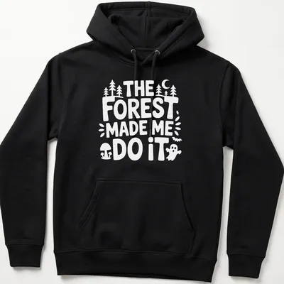 Vintage print featuring a forest scene and the text The Forest Made Me Do It — printed on a unisex hoodie