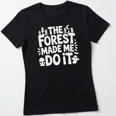 Vintage print featuring a forest scene and the text The Forest Made Me Do It — printed on a women's shirt