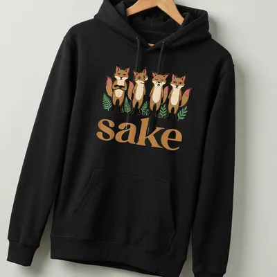 Cartoon design with four playful foxes and the text 'sake' in brown, cream, green, and pink. — printed on a unisex hoodie