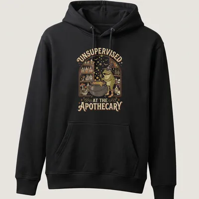 Vintage cartoon frog brewing potion with humorous text about apothecary — printed on a unisex hoodie