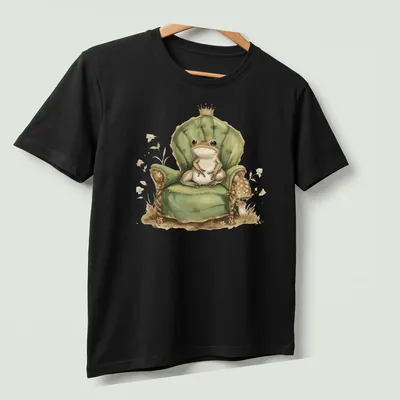 Whimsical illustration of a frog prince in a crown on his throne. — printed on a unisex t-shirt (angled view)