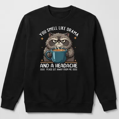 Cartoonish grumpy cat holding a coffee mug with humorous text about drama — printed on a unisex sweatshirt