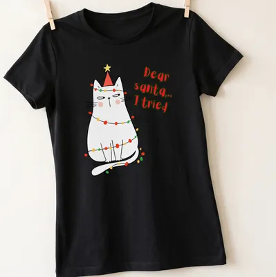 Kawaii cat in Santa hat with 'Dear santa... I tried' text in festive colors — printed on a women's shirt
