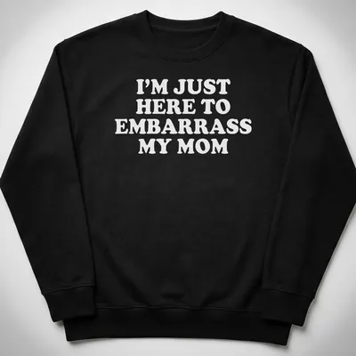 Bold white text humorously declares 'I'm Just Here To Embarrass My Mom' on a playful — printed on a unisex sweatshirt