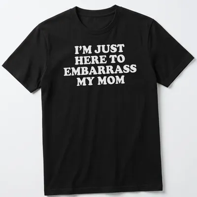 Bold white text humorously declares 'I'm Just Here To Embarrass My Mom' on a playful T-shirt