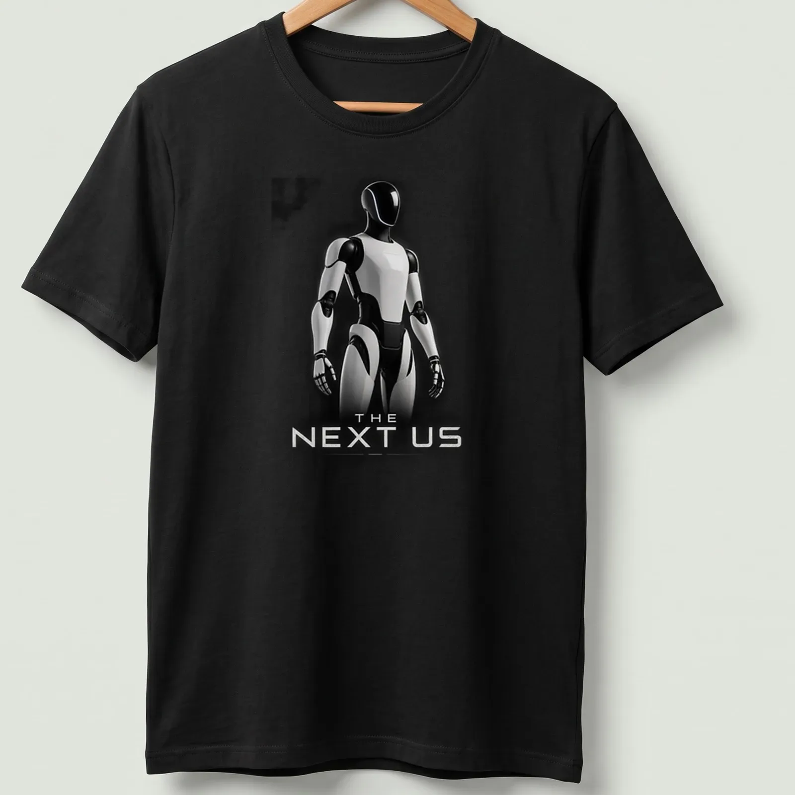 Silhouette of a futuristic humanoid robot with the text 'THE NEXT US' in black, white, and gray. — printed on a unisex t-shirt
