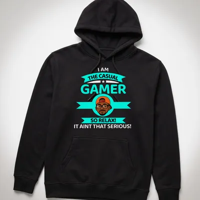 Cartoon design with text 'THE CASUAL GAMER SO RELAX!' in turquoise, black, orange, and white colors. — printed on a unisex hoodie
