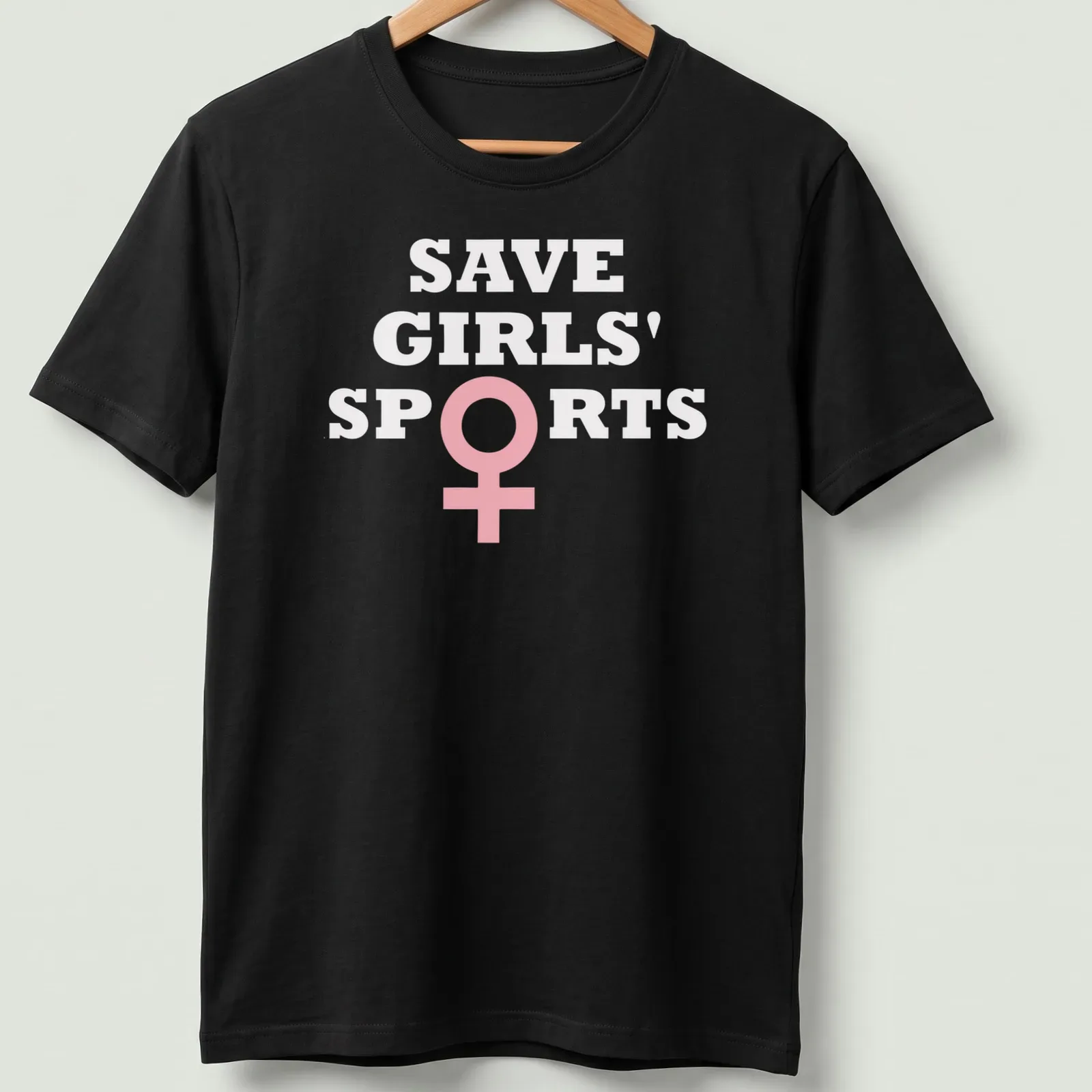 Bold typography t-shirt with the message Save Girls' Sports Biological Females in pink and white — printed on a unisex t-shirt