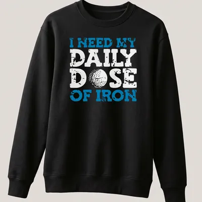 Distressed golf ball graphic with the text 'I NEED MY DAILY DOSE OF IRON' — printed on a unisex sweatshirt