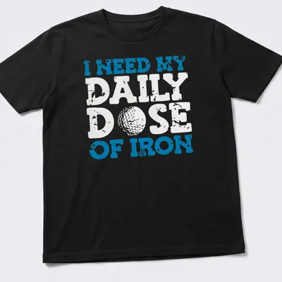 Distressed golf ball graphic with the text 'I NEED MY DAILY DOSE OF IRON'