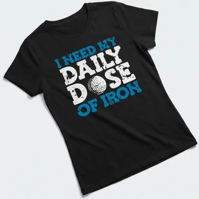 Distressed golf ball graphic with the text 'I NEED MY DAILY DOSE OF IRON' — printed on a women's shirt