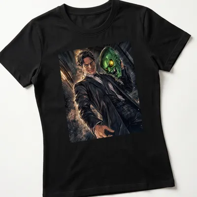 Comic book style print of Green Goblin in green and black with yellow and brown accents — printed on a women's shirt